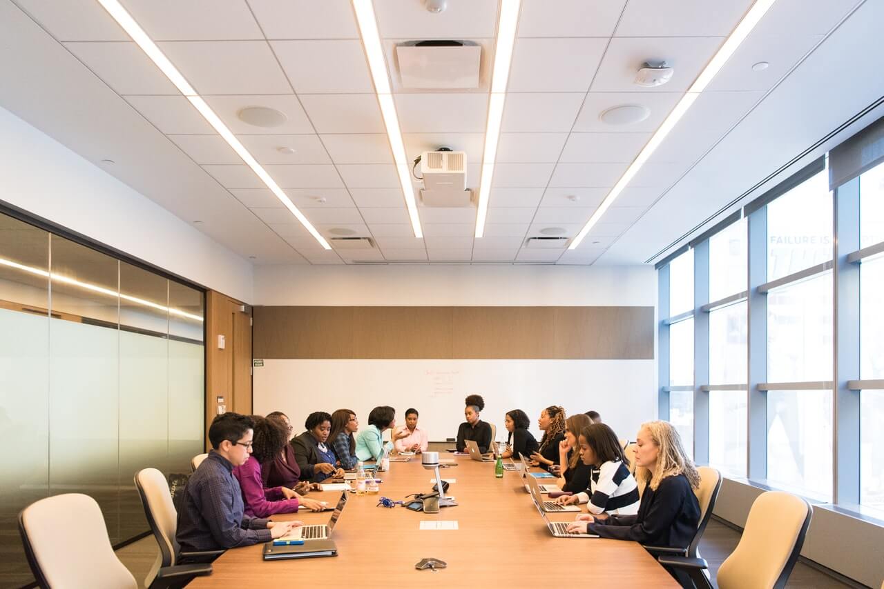 People having a board meeting in a conference room