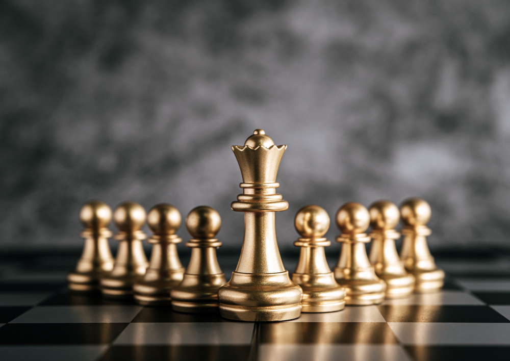 Gold chess on chess board game for business metaphor leadership concept.