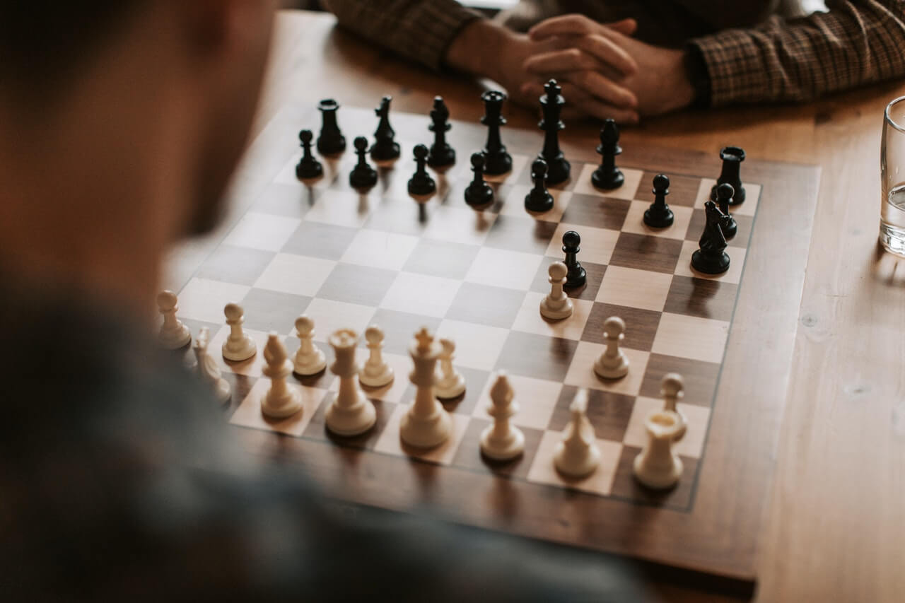 Men playing in a chess competition