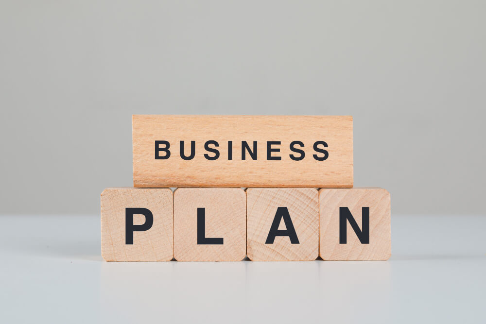 Business plan concept with wooden cubes