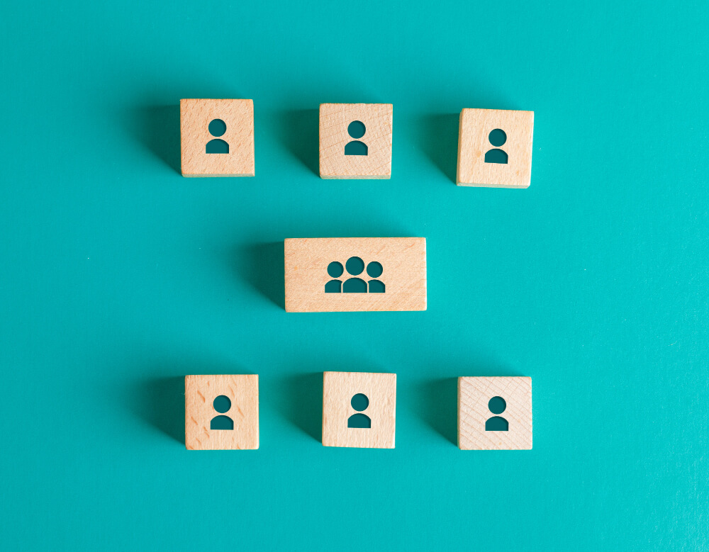 Business organizational structure concept with wooden people icons