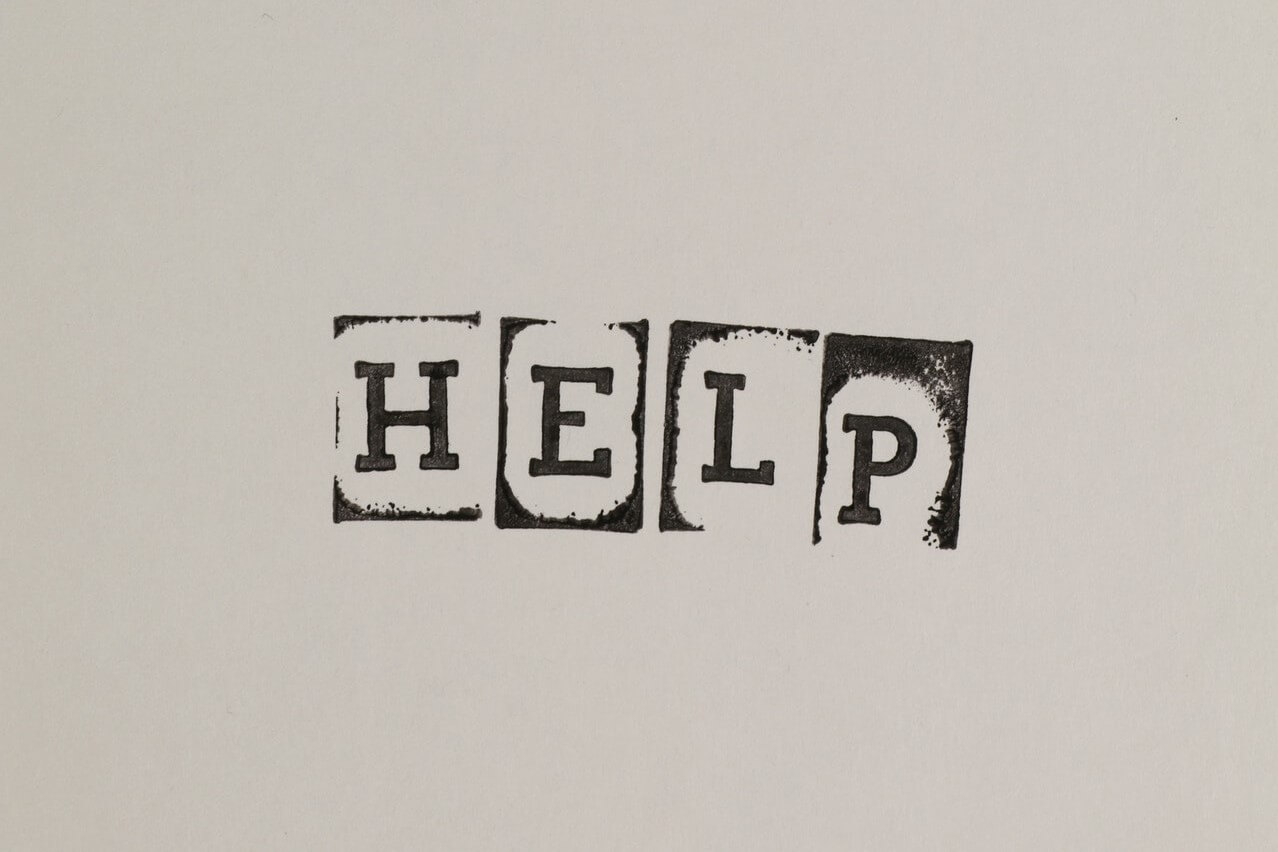 Help written on a grey surface