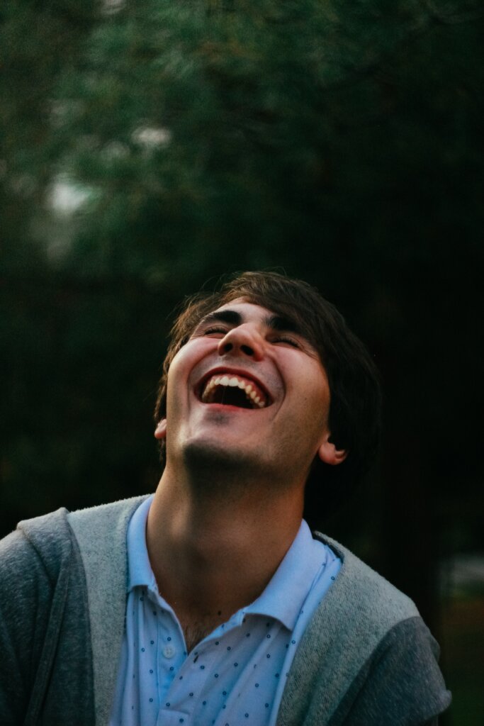 man in gray sweater smiling | lapsed donors