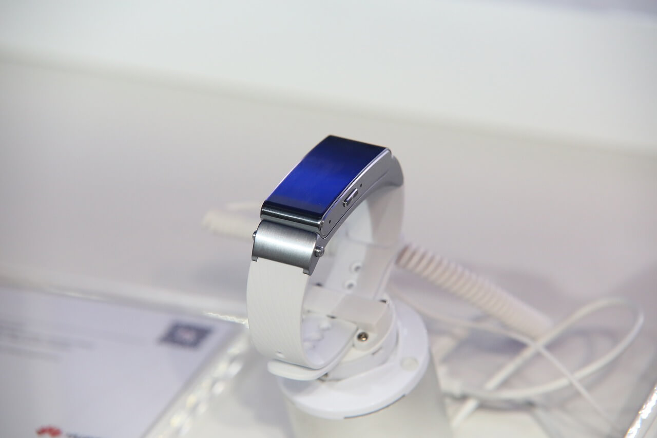 White smartwatch with a bluish screen