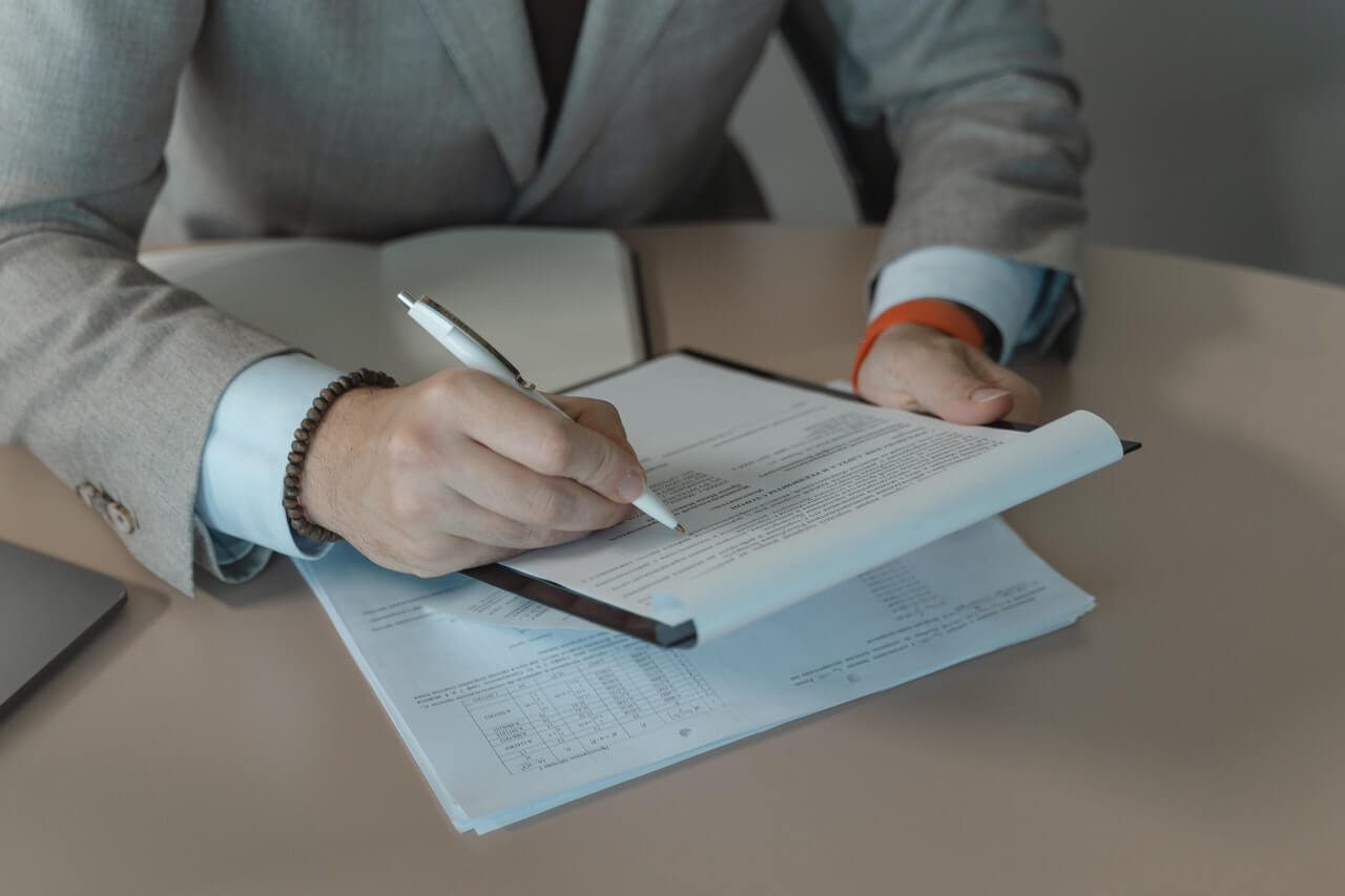 Person in suit going through a business document