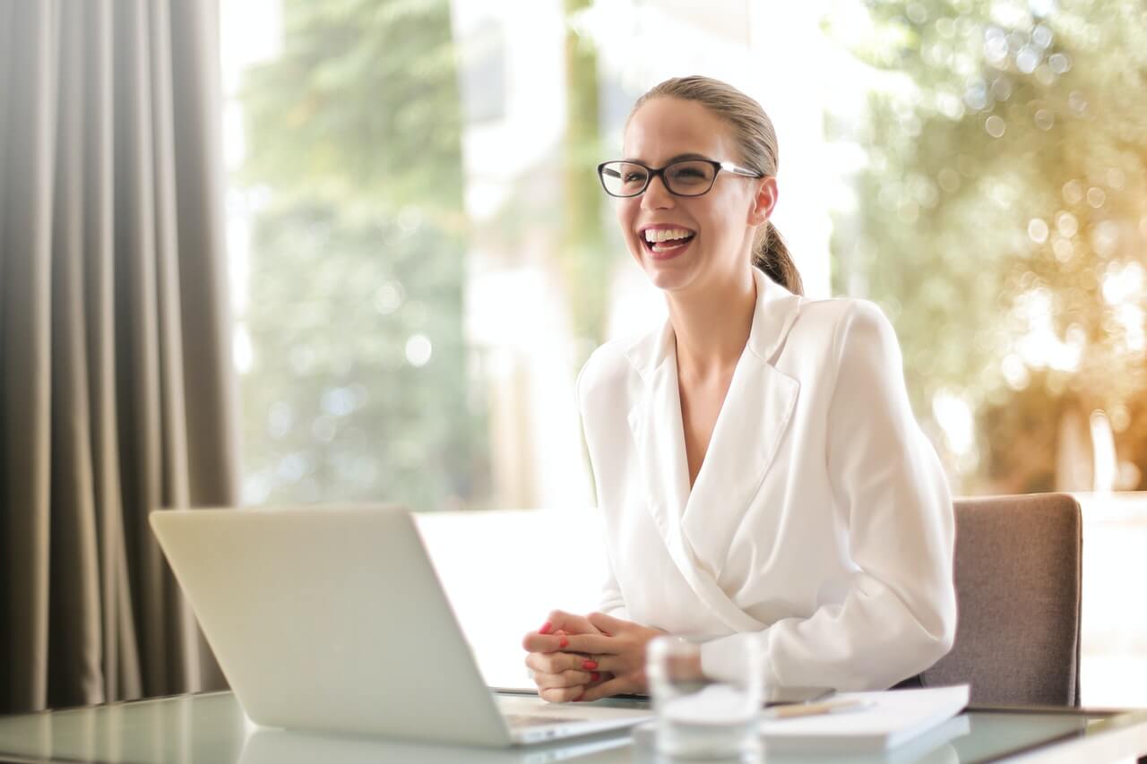 A female entrepreneur laughing in her office