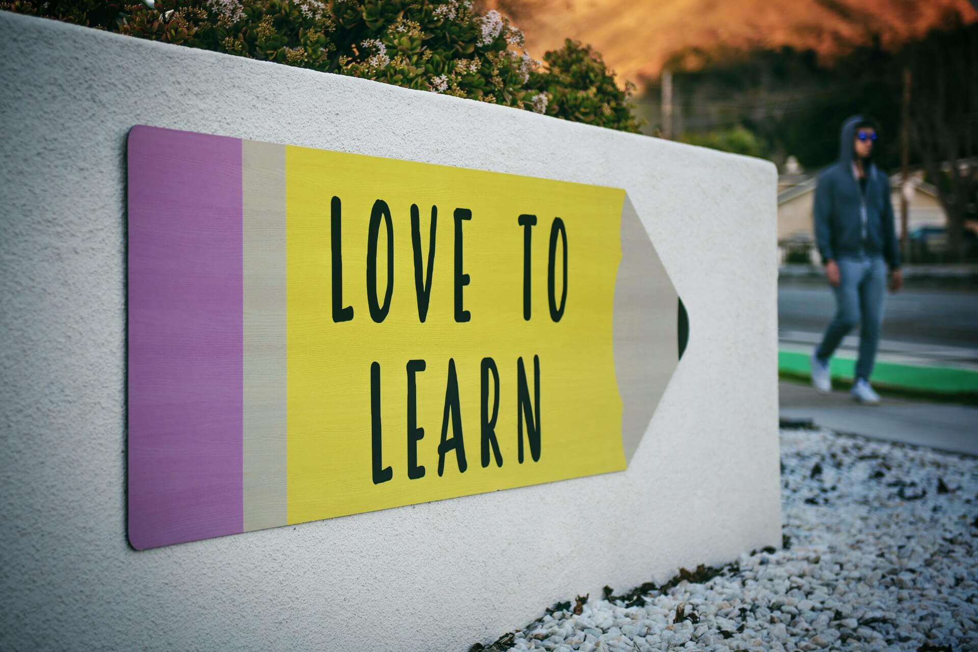 A signage with the words love to learn