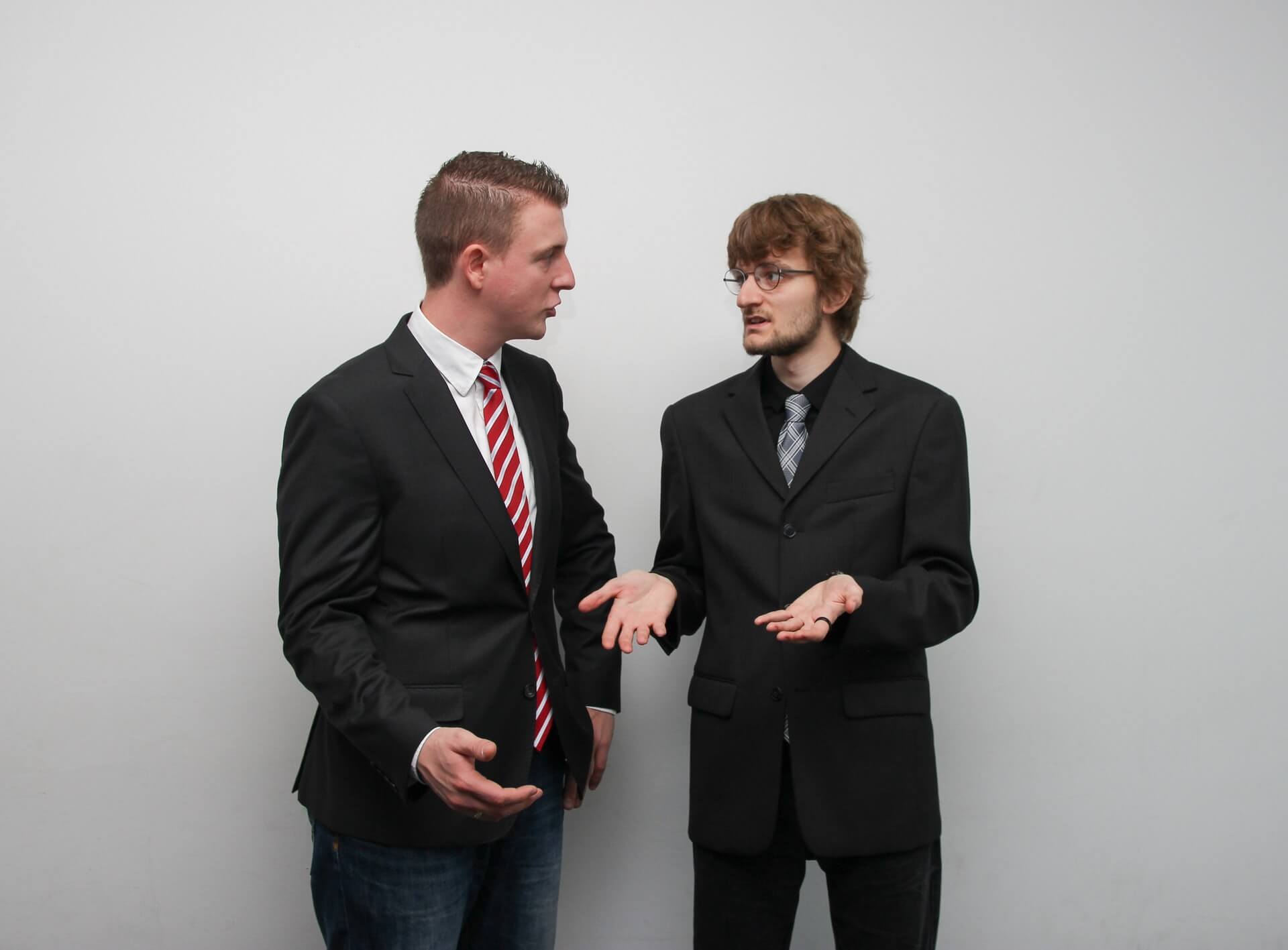 Two men in suit having a work conversation