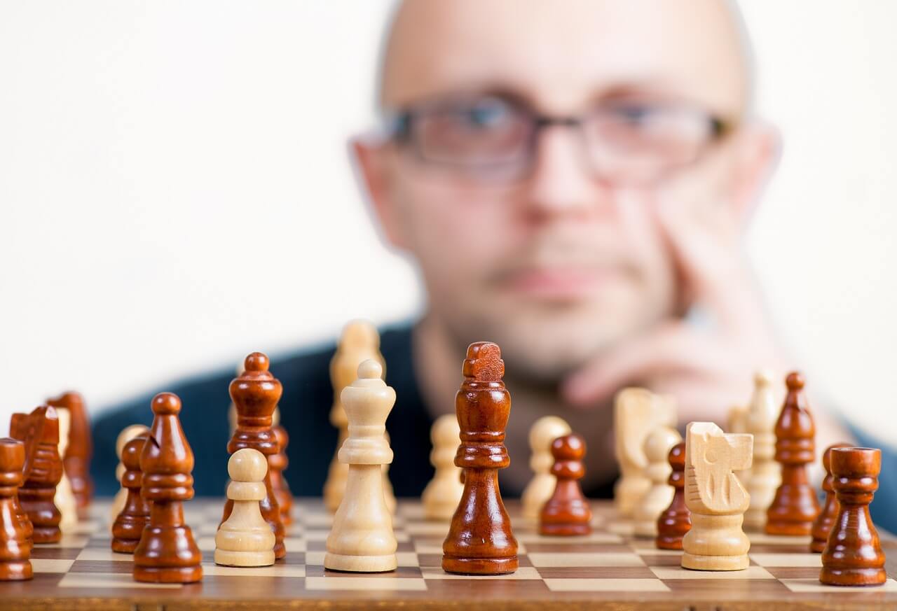 A man playing a strategic game of chess