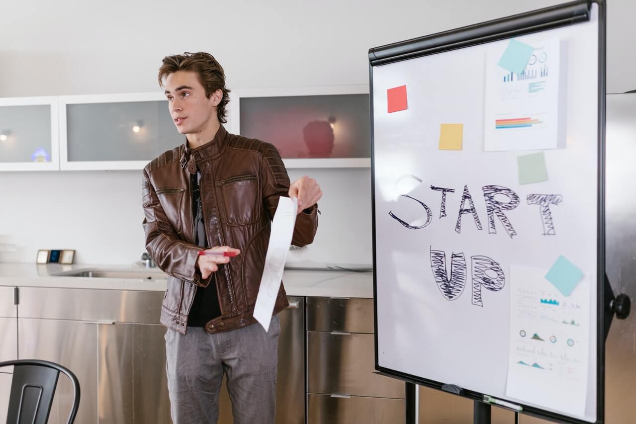 Young male presenting a fundraising plan for start-ups