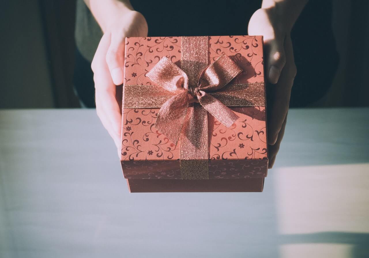 Someone holding a gift box