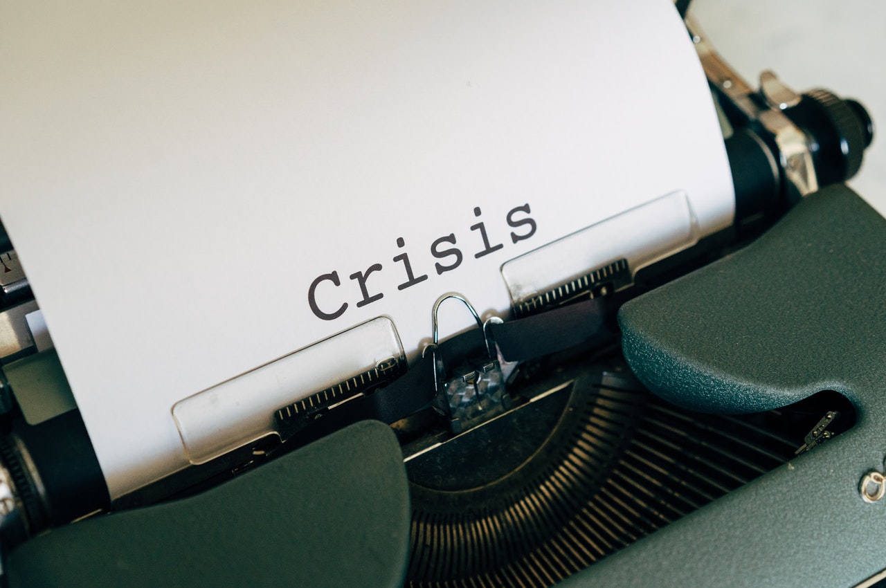 Crisis-written-on-a-white-paper-with-a-typewriter