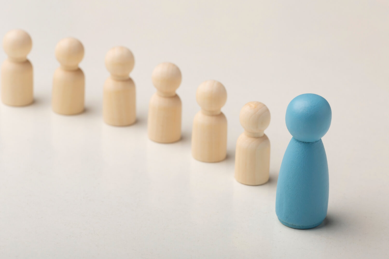 A blue pawn leading the other pawns