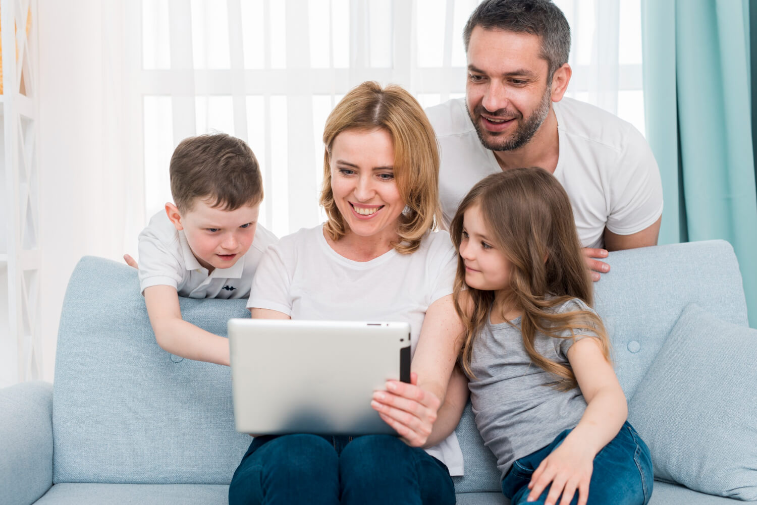 Family-watching-an-online-blog-with-their-tab