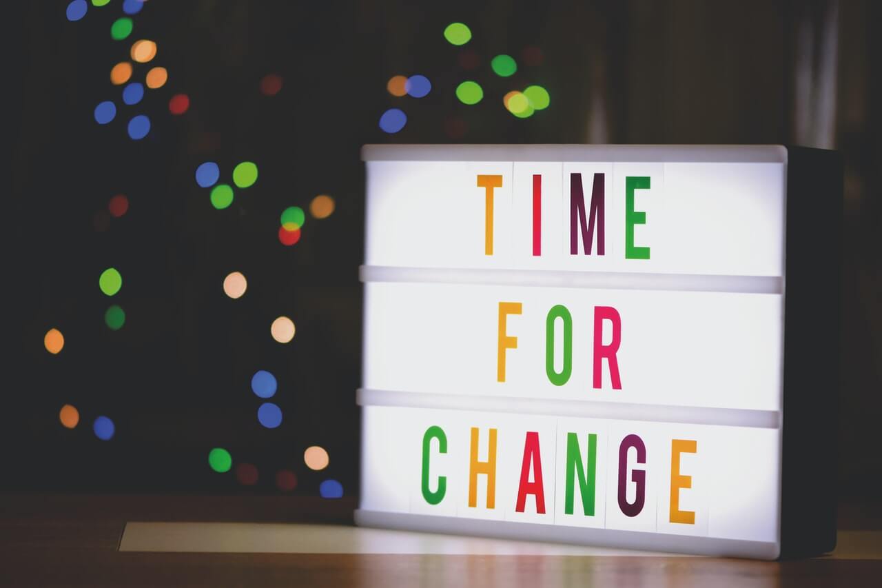 a sign with the words time for change written with led light