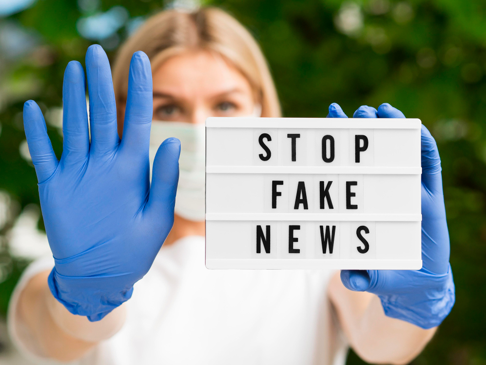 stop-fake-news-blurred-woman-wearing-gloves