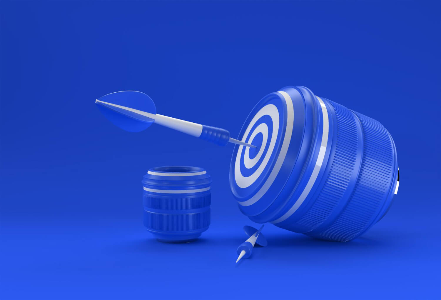 A targeted dart on a camera lens on a blue background
