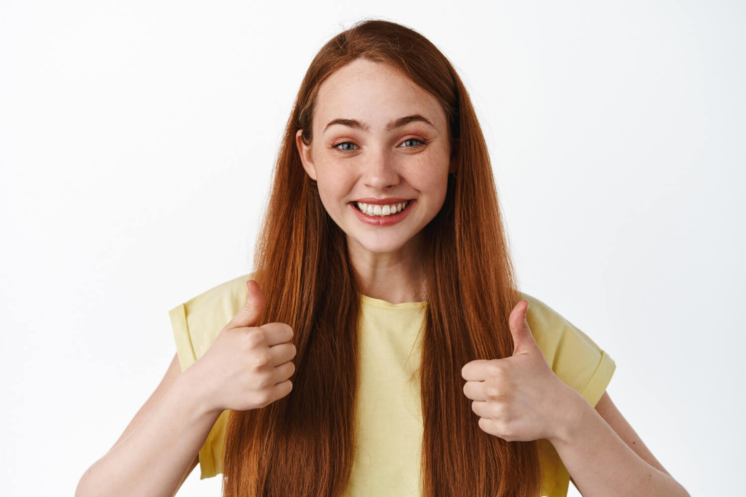 Young cheerful lady showing thumbs up