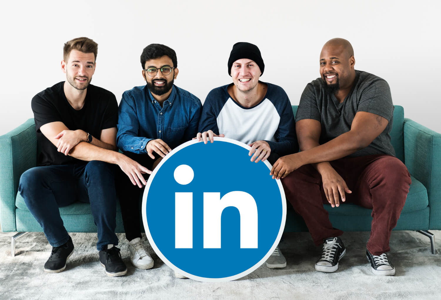 People seating while holding a linkedin logo