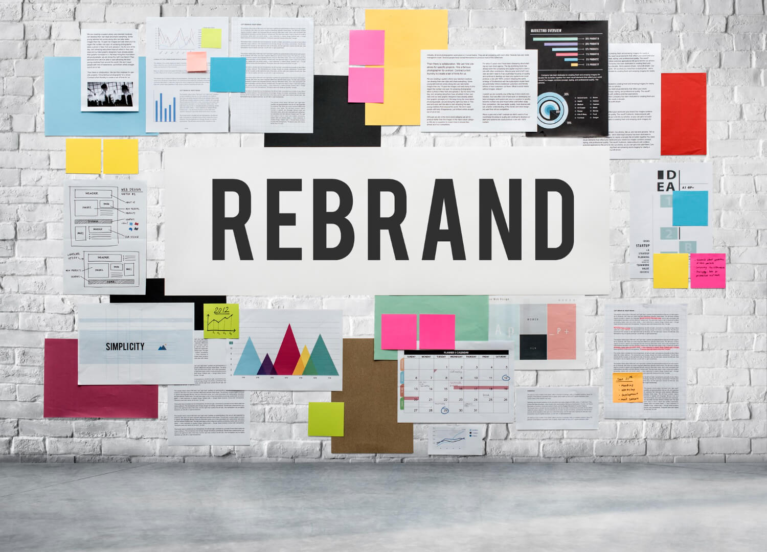Rebrand written boldly on a wall