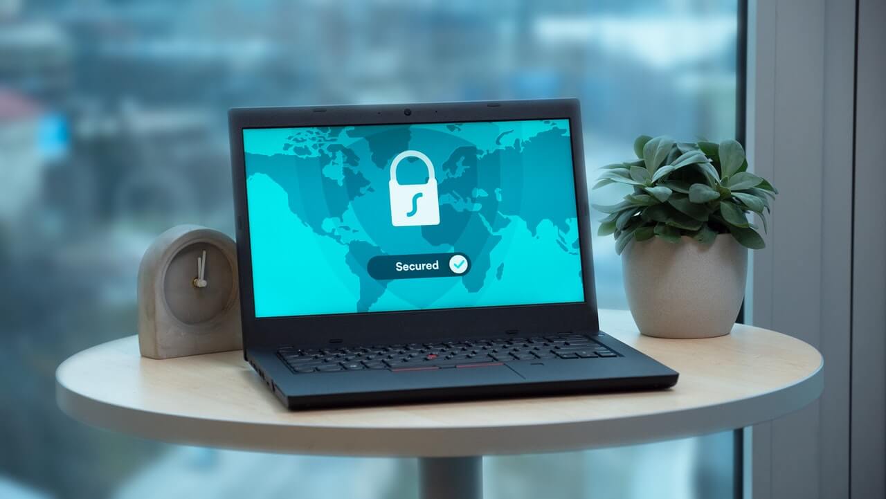 Surfshark review: A black laptop screen using surfshark vpn to connect to the internet