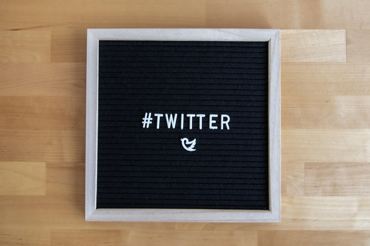 Twitter logo on a black textboard