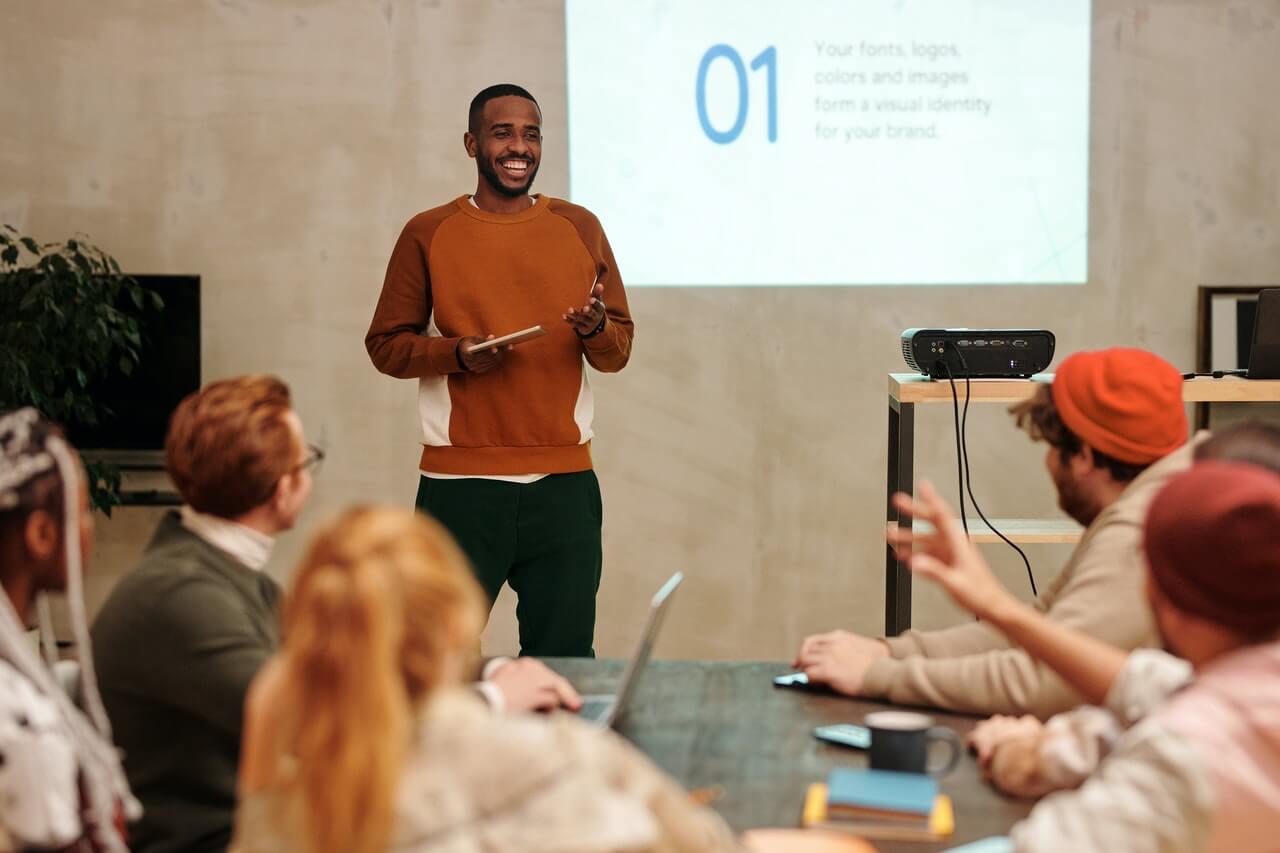 Young businessman laughing during presentation