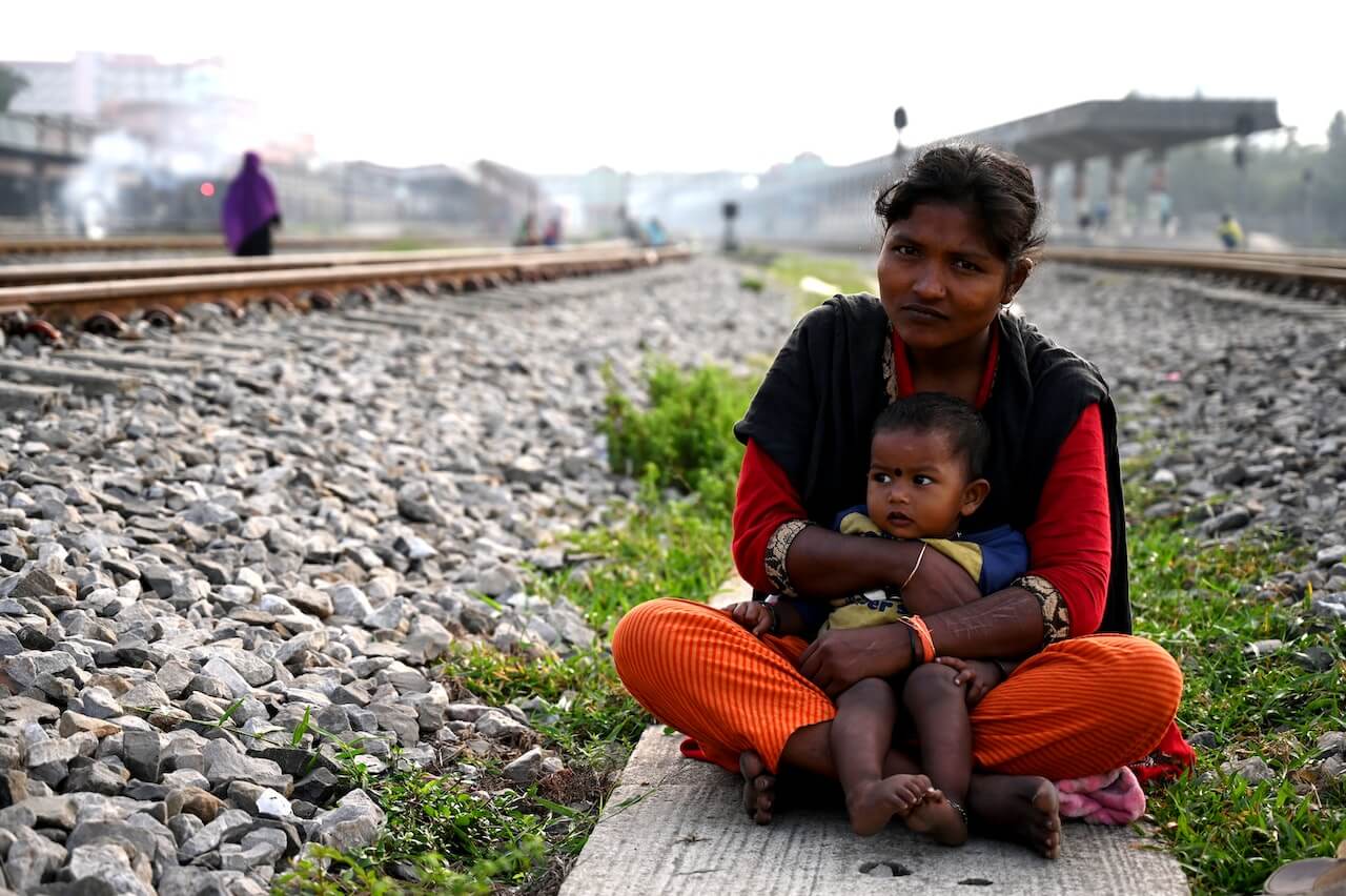 An-indian-mother-and-child-sitting-on-a-railway