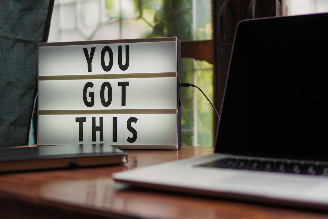 Motivational sign on an office desk