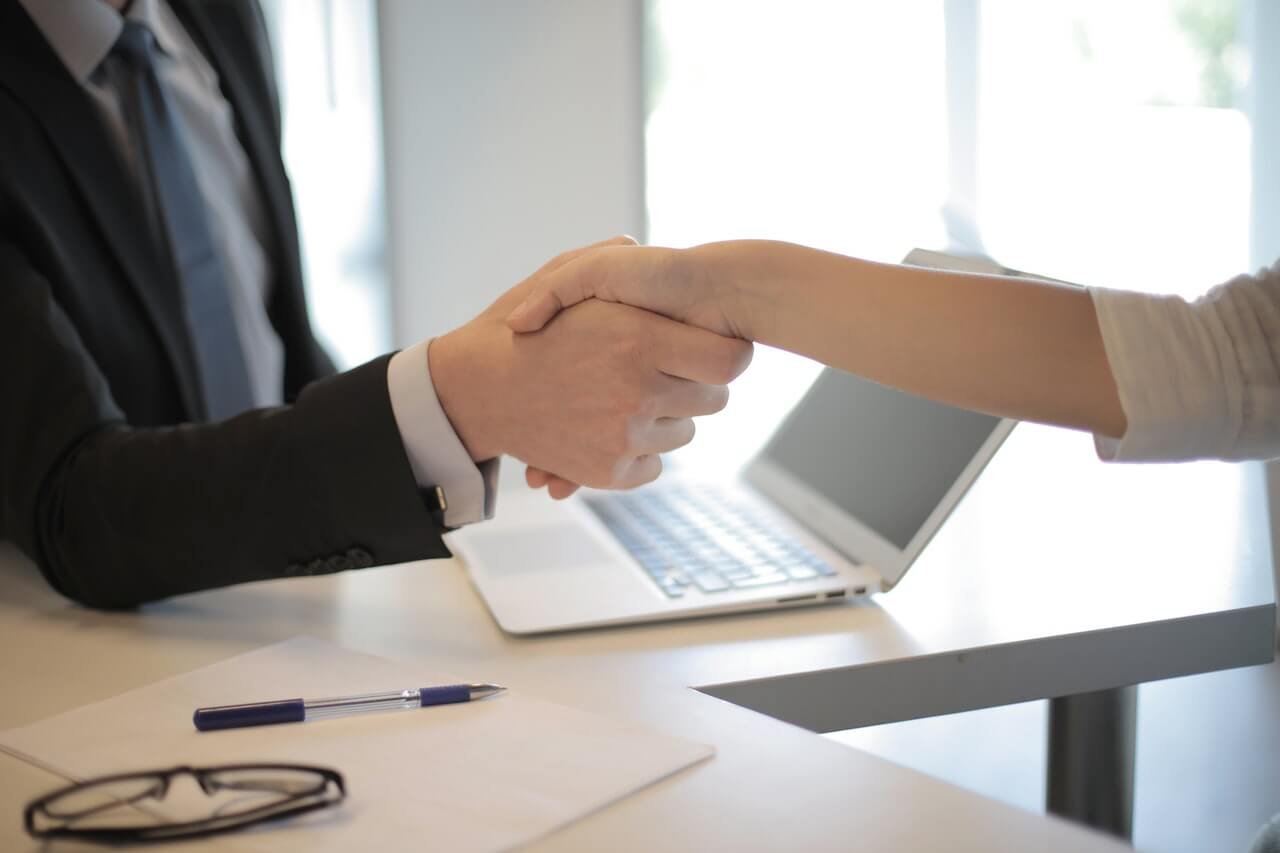 Finding the Beauty of Your Work: handshake between two businesspeople