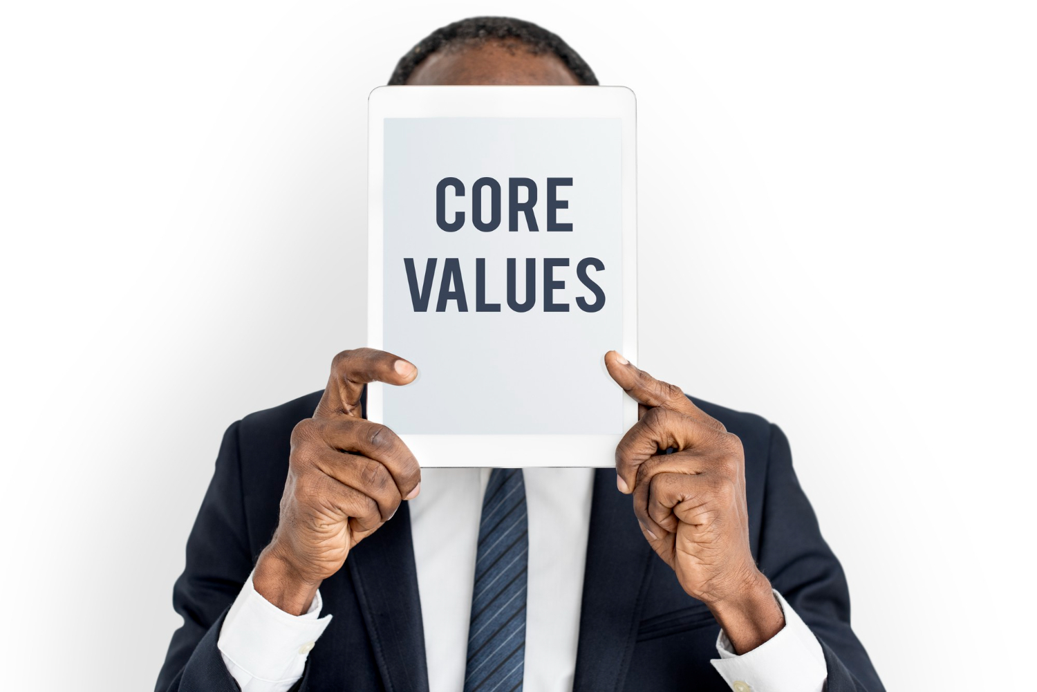 Young man holding a board saying core values