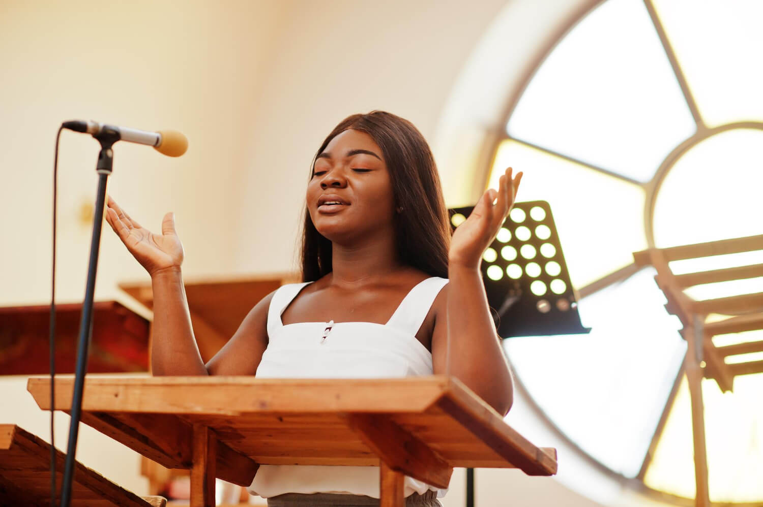 a gospel singer worshipping in her church