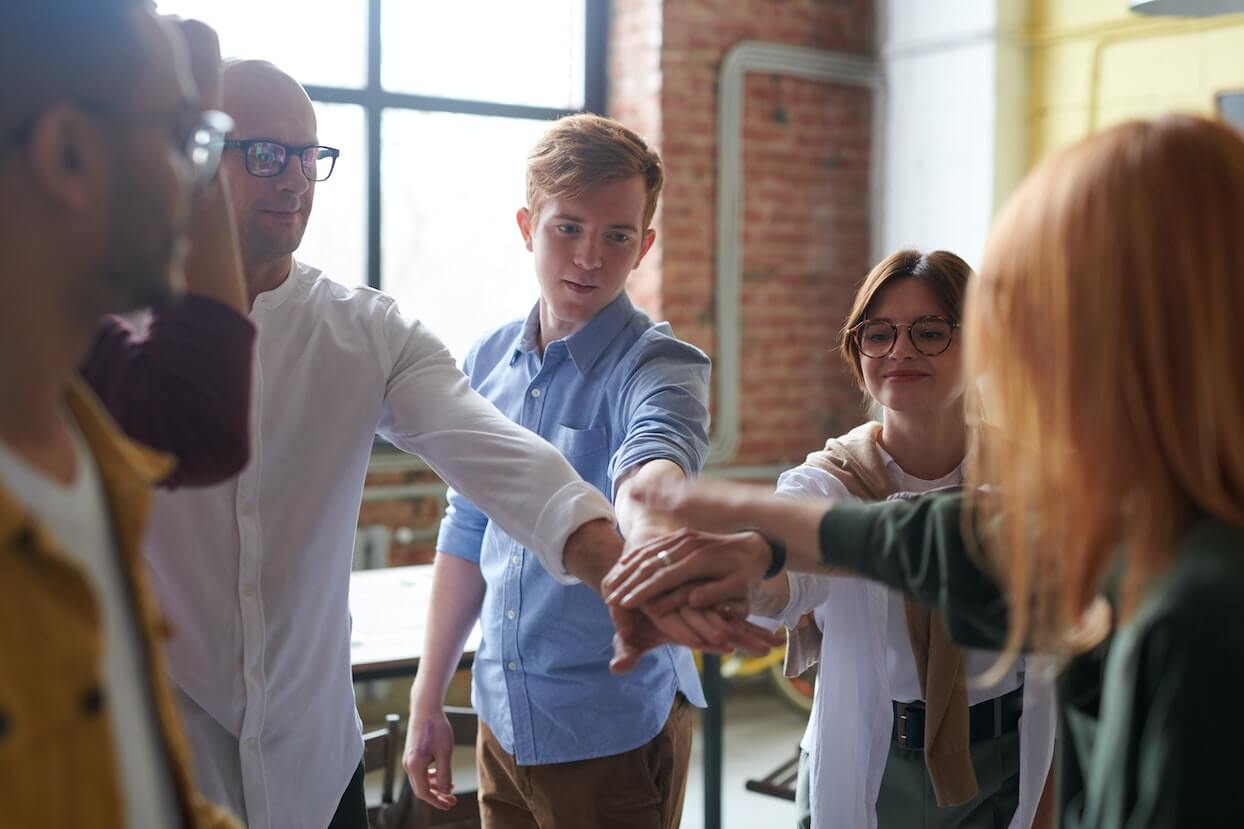 group-of-work-colleagues-having-a-fist-bump