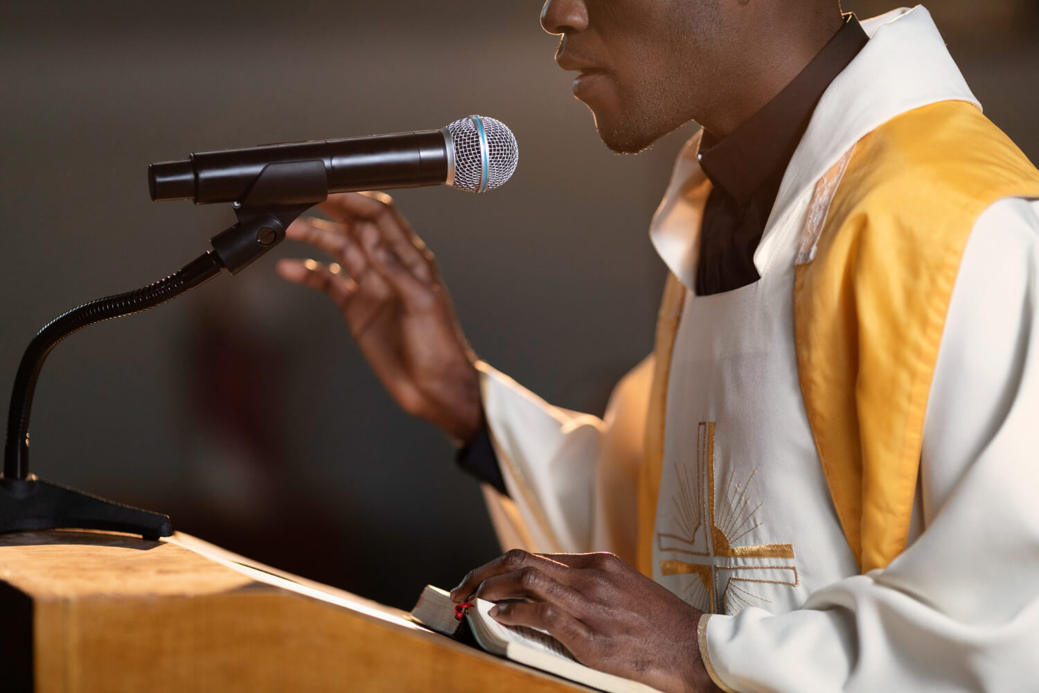 young-male-priest-preaching-church-using-microphone