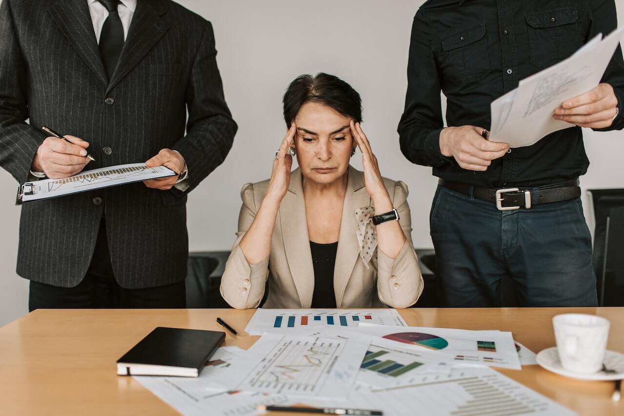 A-female-stressed-during-a-meeting-on-crisis-management-