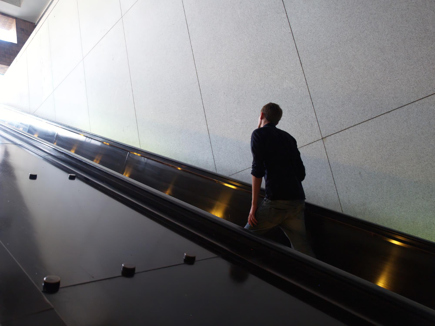 A-person-moving-up-an-escalator-rising-new-heights
