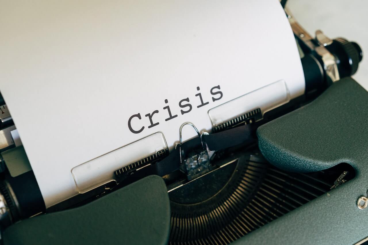 Crisis on a White Paper On A Vintage Typewriter