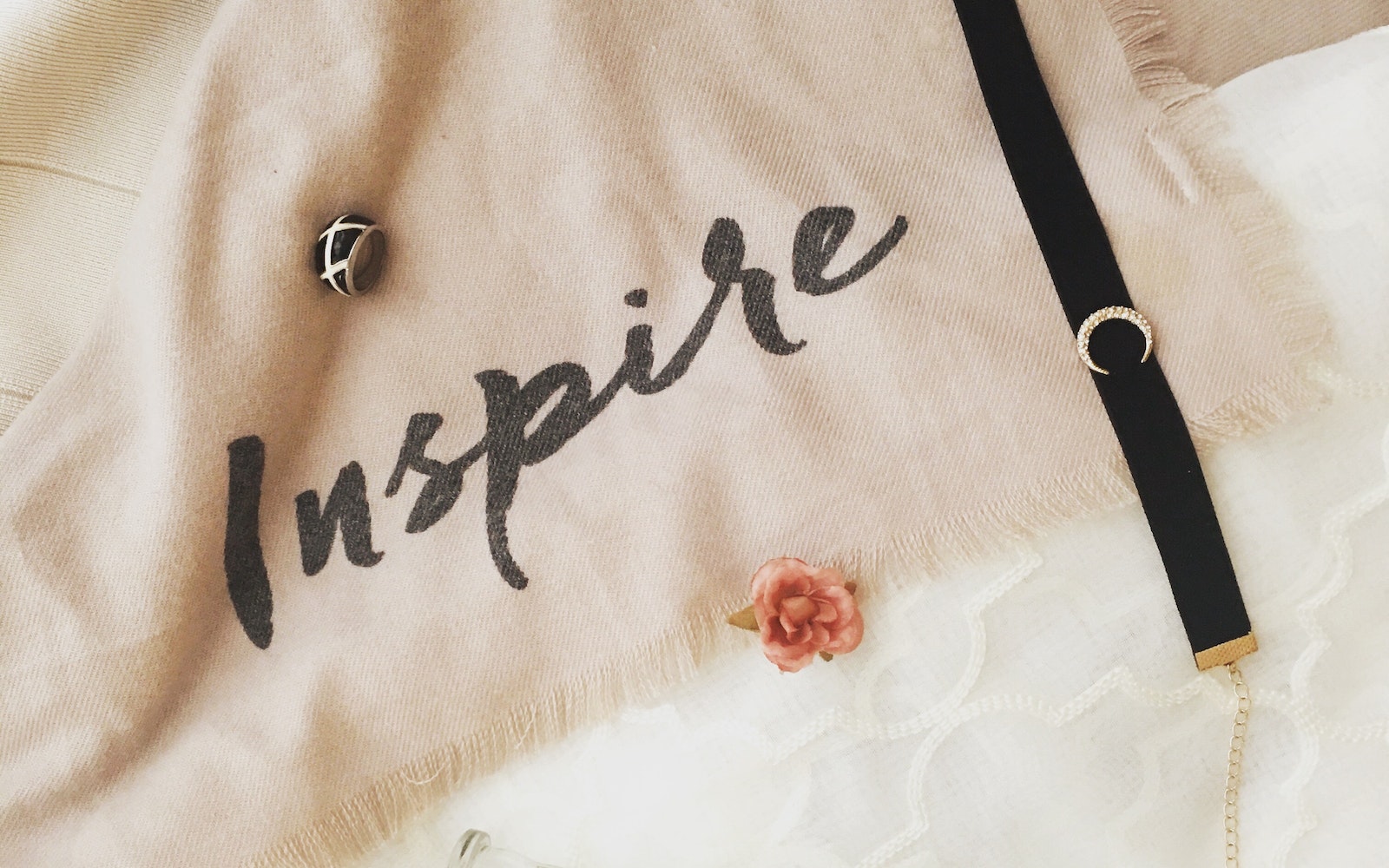 The text "inspire" written on a cloth