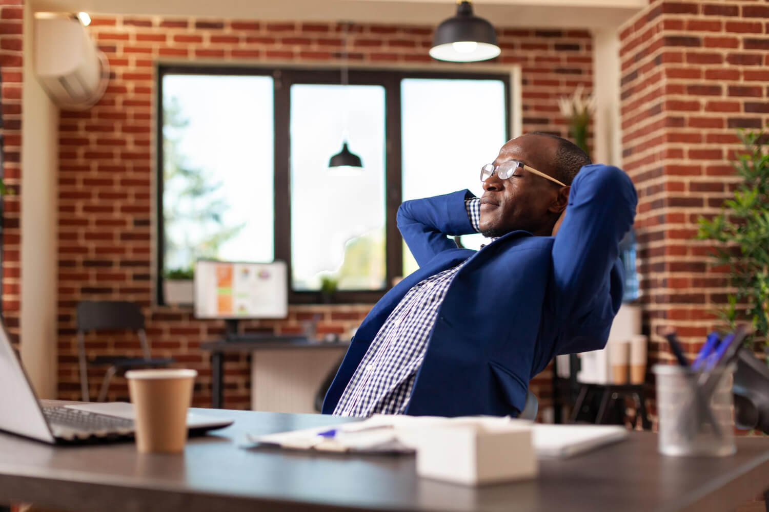business-man-relaxing-after-finishing-task-taking-break-