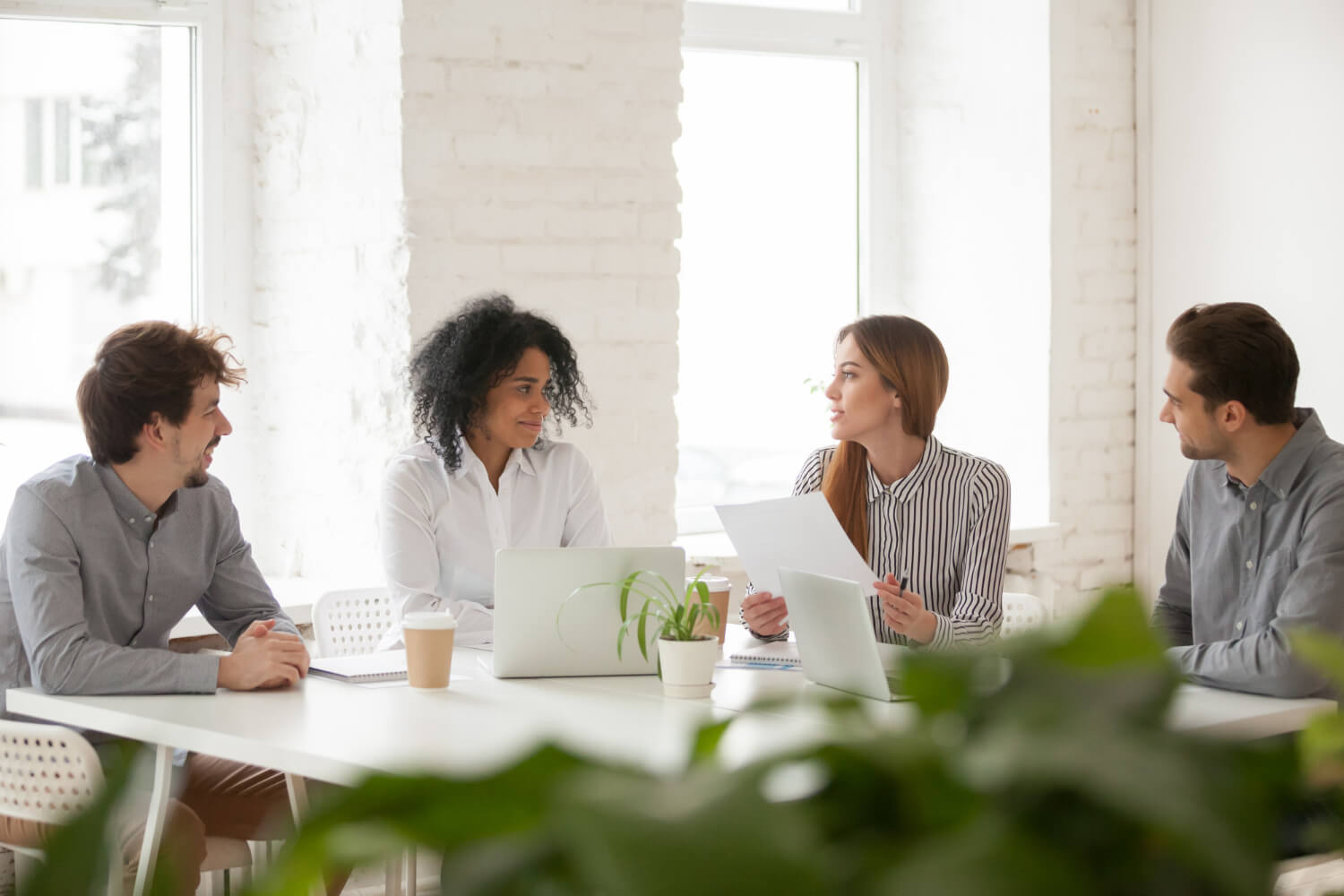 female-manager-and-colleagues-having-a-team-meeting