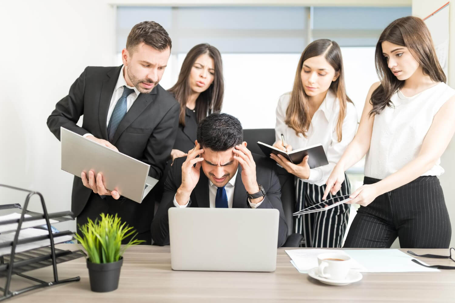 stressed-businessman-unable-cope-with-too-much-work-assigned-by-colleagues-office