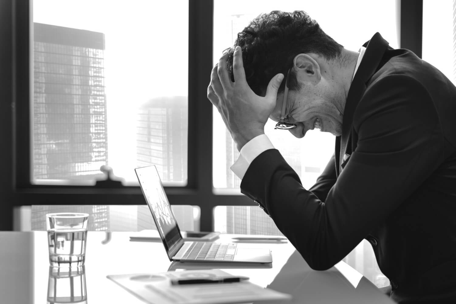 A businessman stressed due to problems arising at work