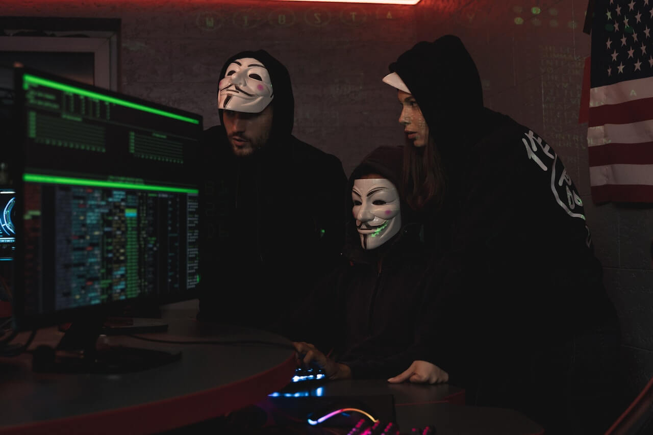 three-hackers-hacking-a-computer-system-