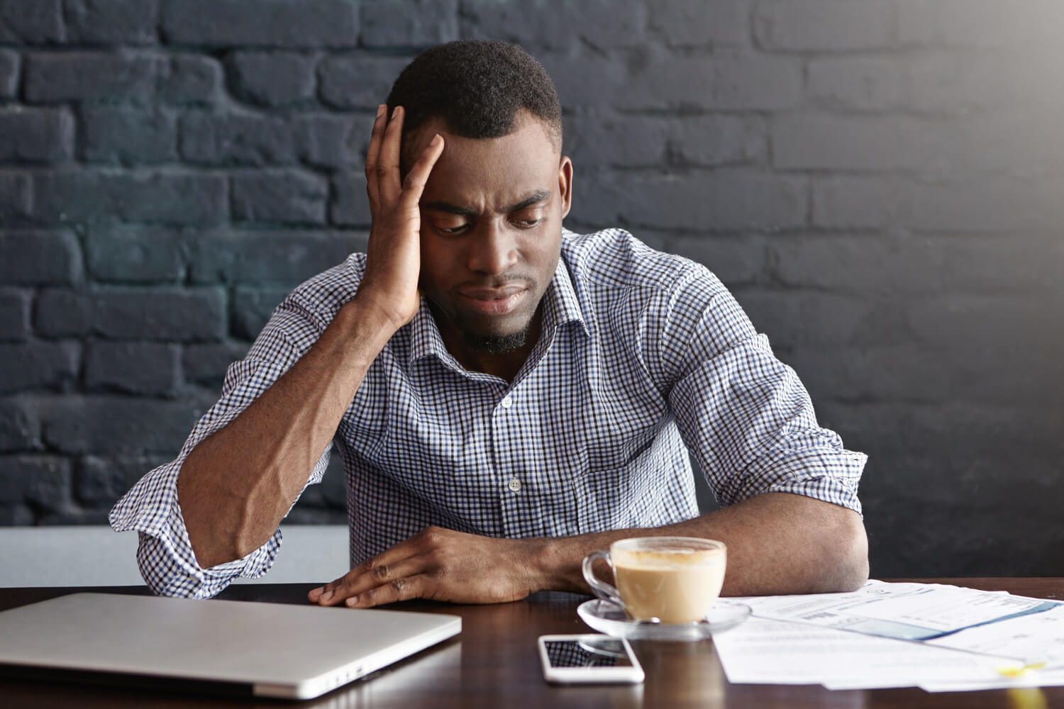 unhappy-african-businessman-feeling-stressed-frustrated