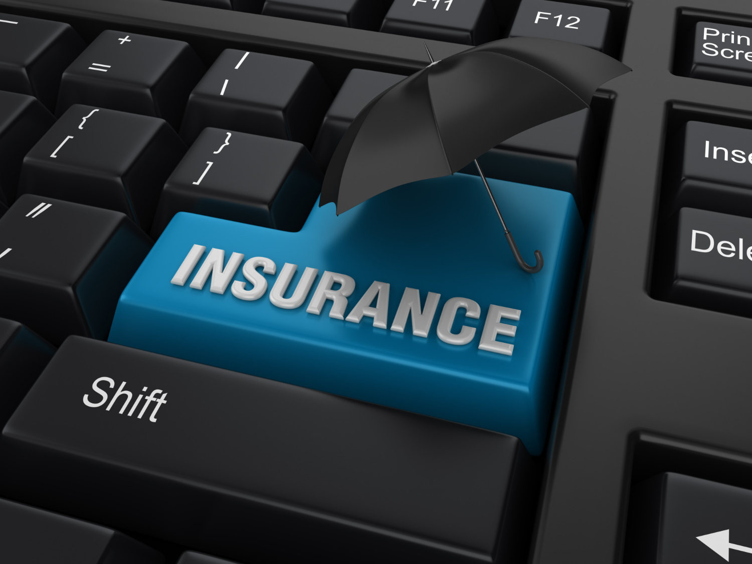 The word "insurance" written on a black keyboard