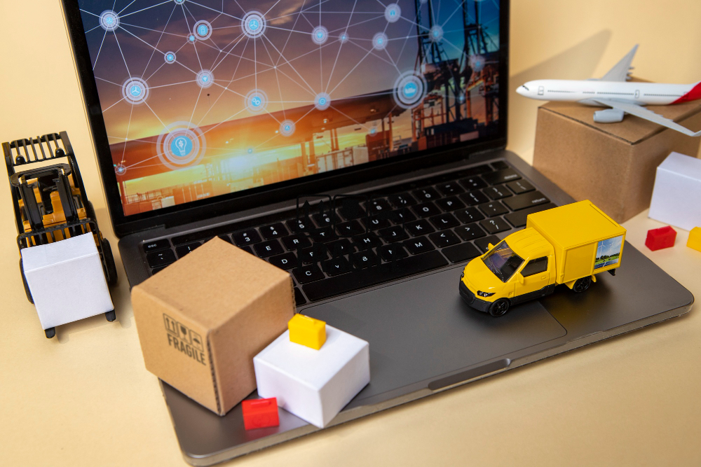 vehicles and package boxes on laptop supply chain representation