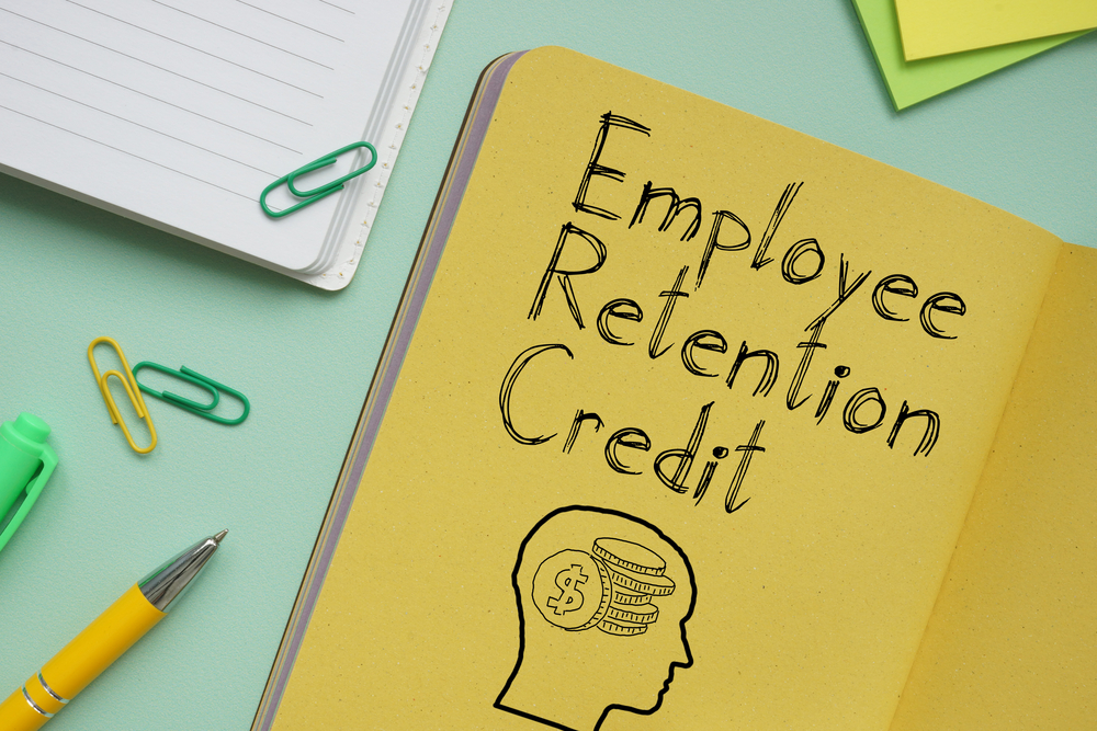 Employee Retention Credit ERC is shown on the business photo using the text