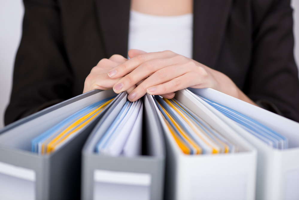 Businesswoman With Binders