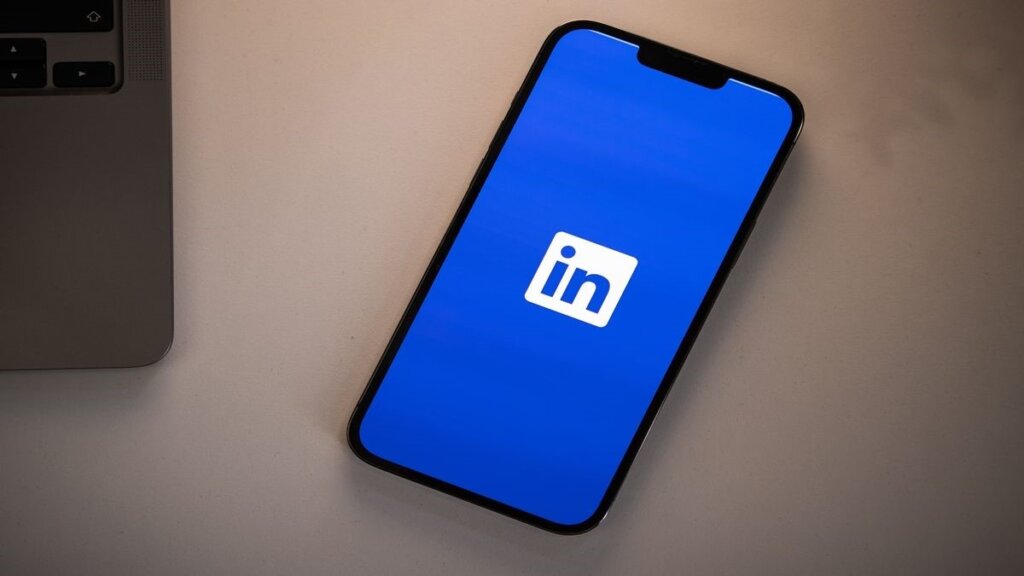 Mobile phone opening the LinkedIn app